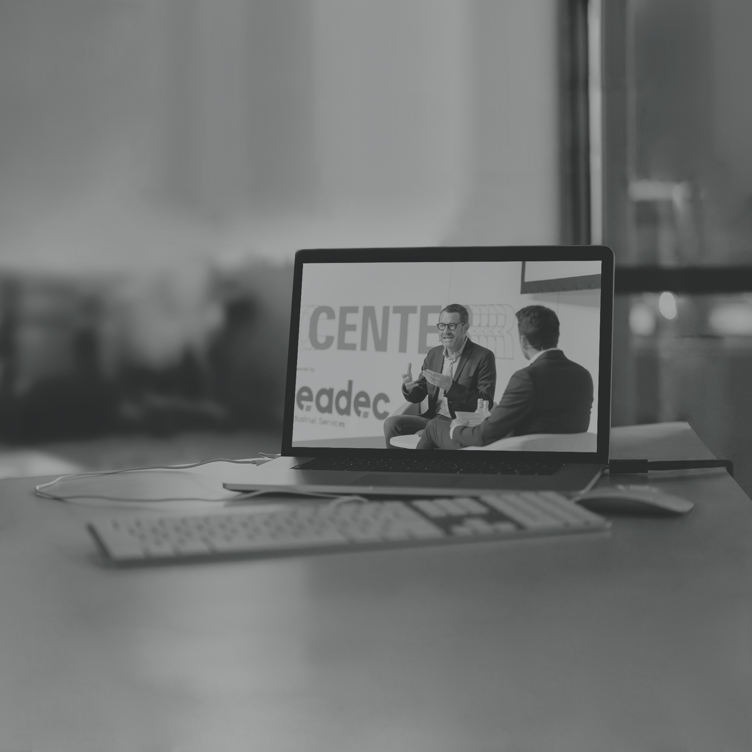 grey_mockup-featuring-a-macbook-placed-on-a-desk-at-an-office-2441-el1